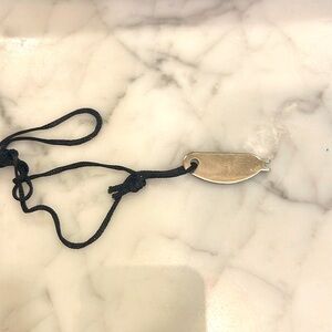 Key to Tumi leather clutch